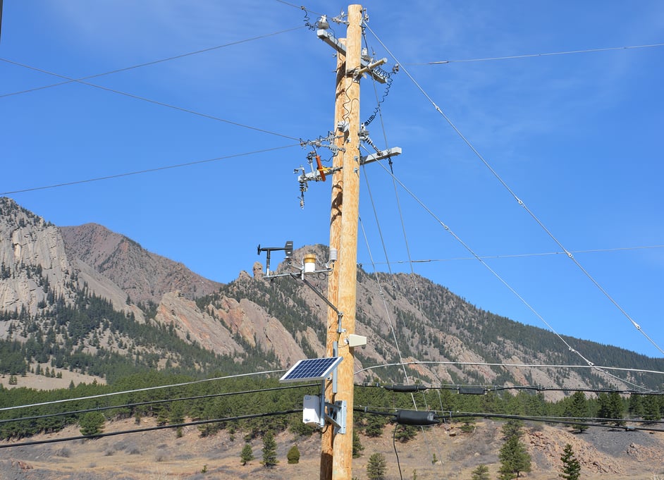 A weather station installed on a utility pole near the Flatirons in Colorado