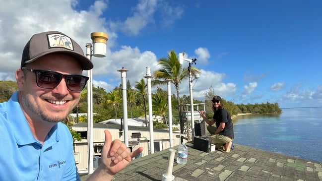 Matt Wanink installing a weather station in Hawaii